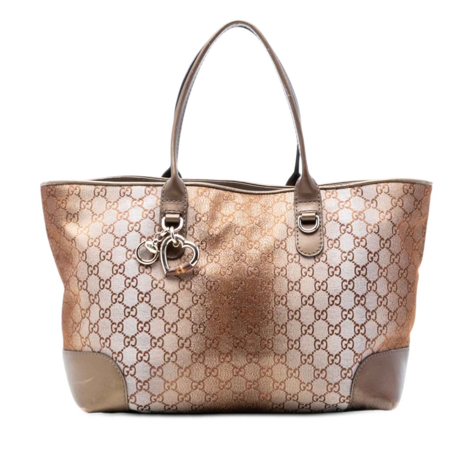 Gucci Heart Bit GG Lurex Canvas Tote Bag: Gucci Heart Bit GG Lurex Canvas Tote Bag This Gucci GG Lurex Heart Bit Tote features a canvas body with leather trim, complemented by a metal charm and flat leather straps. The bag has an open top wit