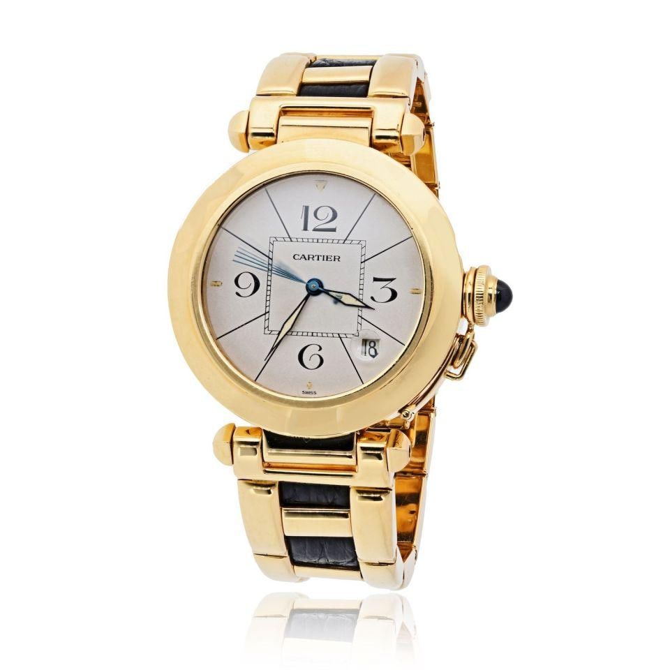 Cartier Pasha 1989 18K Gold 38mm Vintage Watch With Leather Inlay Accents: Cartier Pasha 1989 18K Gold 38mm Vintage Watch With Leather Inlay Accents This Cartier Pasha wristwatch is crafted in 18K yellow gold and features a 38mm round case with the collection's signature scr