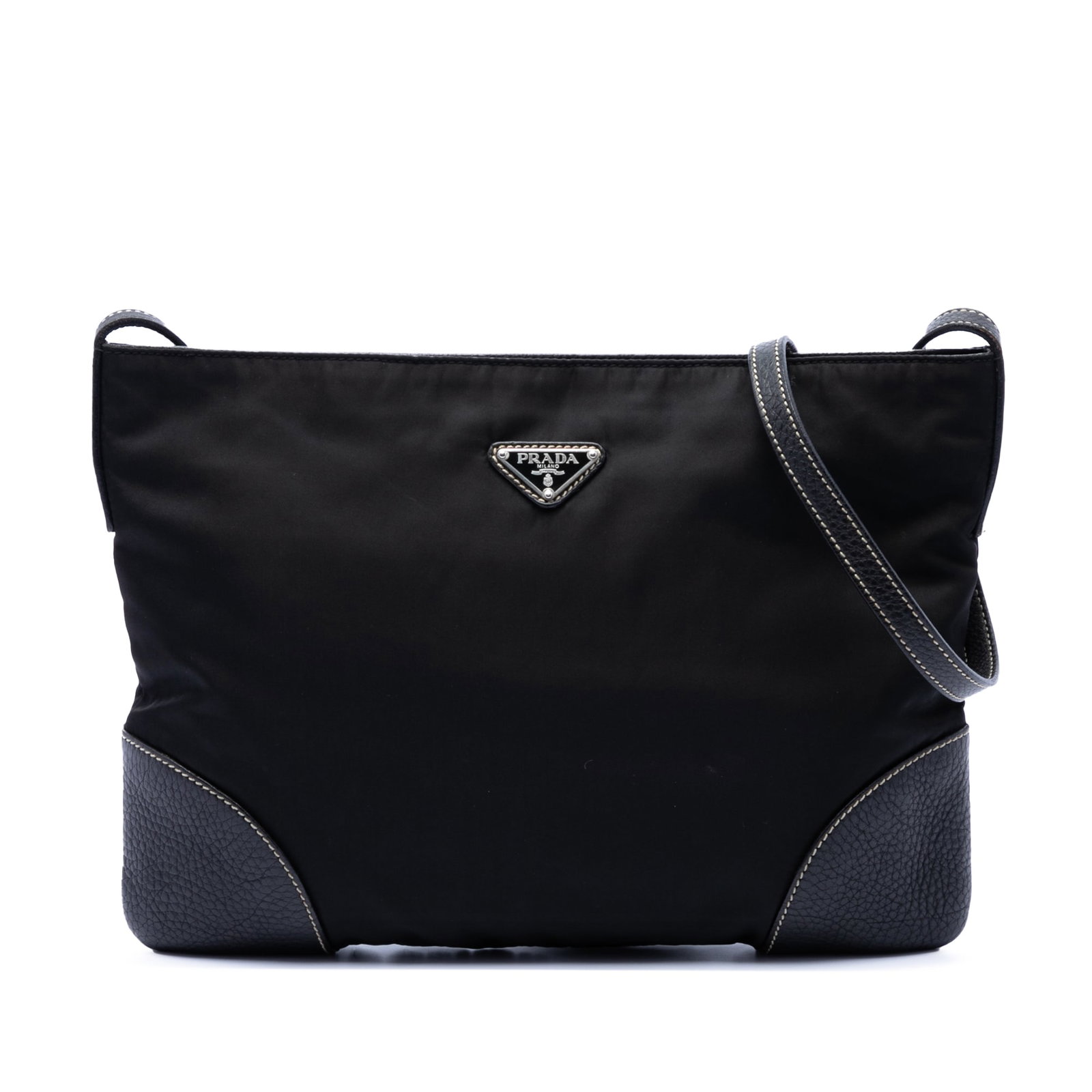 Prada Tessuto Crossbody Bag with Vitello Daino Leather Trim: Prada Tessuto Crossbody Bag with Vitello Daino Leather Trim Prada Vitello Daino Trimmed Tessuto Zip Top Crossbody bag in black, made in Italy. It features a nylon body with leather trim, a flat leathe
