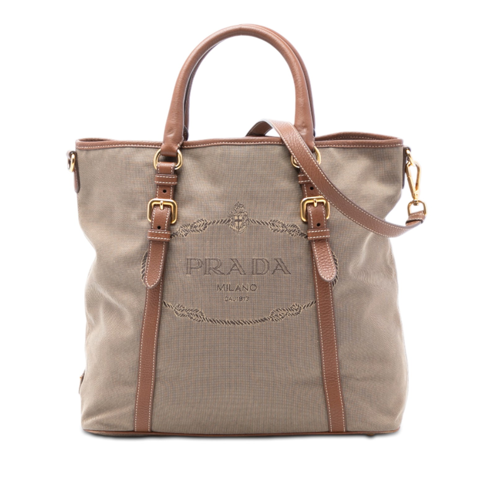 Prada Canapa Beige Canvas Satchel with Leather Trim and Logo: Prada Canapa Beige Canvas Satchel with Leather Trim and Logo This Prada Canvas Canapa Logo Satchel features a beige canvas body accented with leather trim, rolled leather handles, and a detachable fla