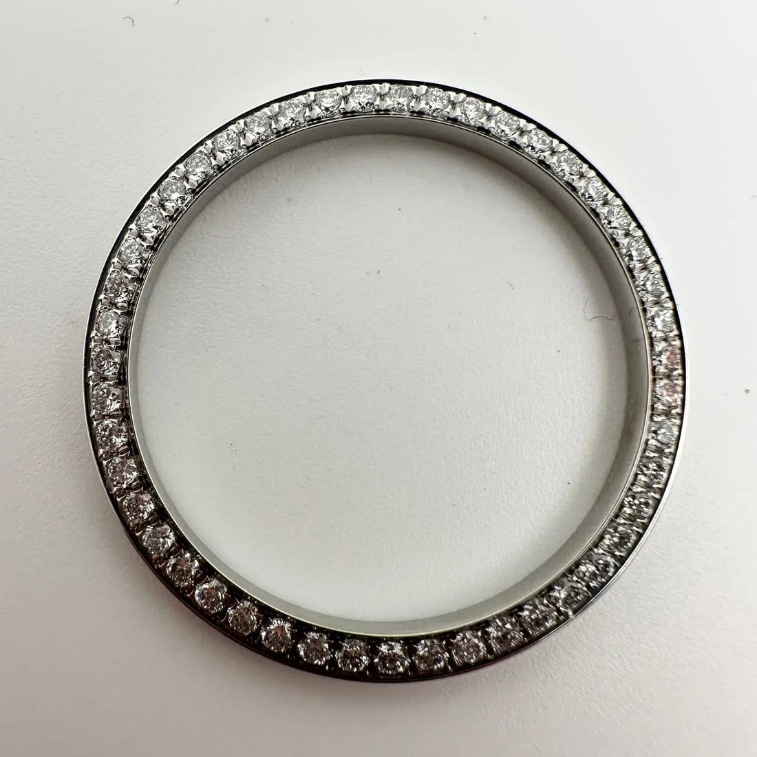 Custom Gray Bezel with 56 Lab Diamonds for Rolex Datejust 36mm: Custom Gray Bezel with 56 Lab Diamonds for Rolex Datejust 36mm Elevate your Rolex Datejust with this exquisite custom bezel featuring 56 lab diamonds. Crafted for a 36mm Datejust model, this luxurious