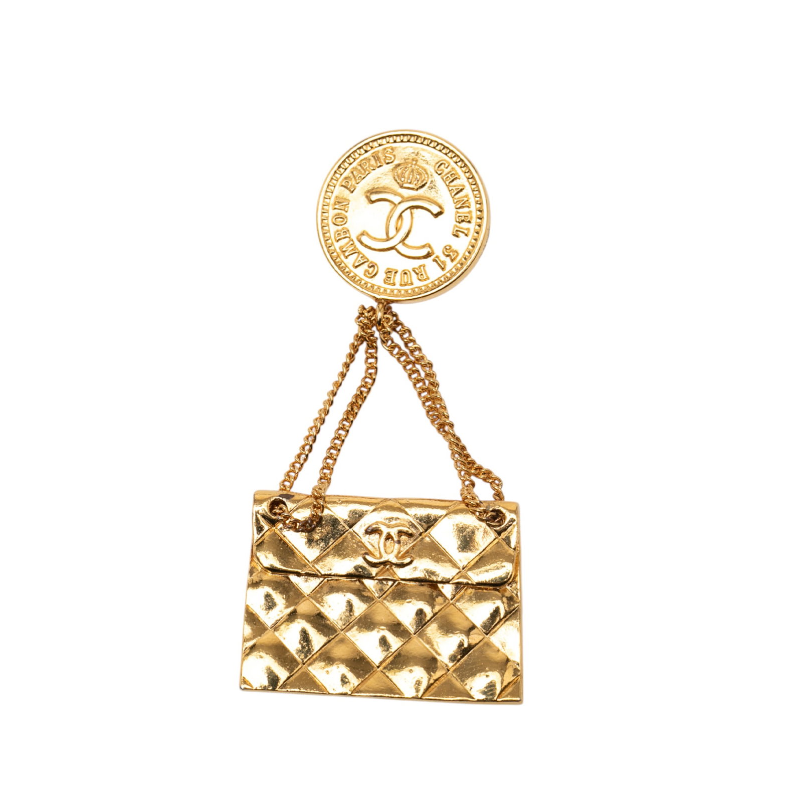 Chanel Quilted Flap Bag Medallion Gold Tone Metal Brooch: Chanel Quilted Flap Bag Medallion Gold Tone Metal Brooch This Chanel brooch features a gold tone metal body with a quilted flap bag medallion design and a back pin closure. Noted signs of use include 