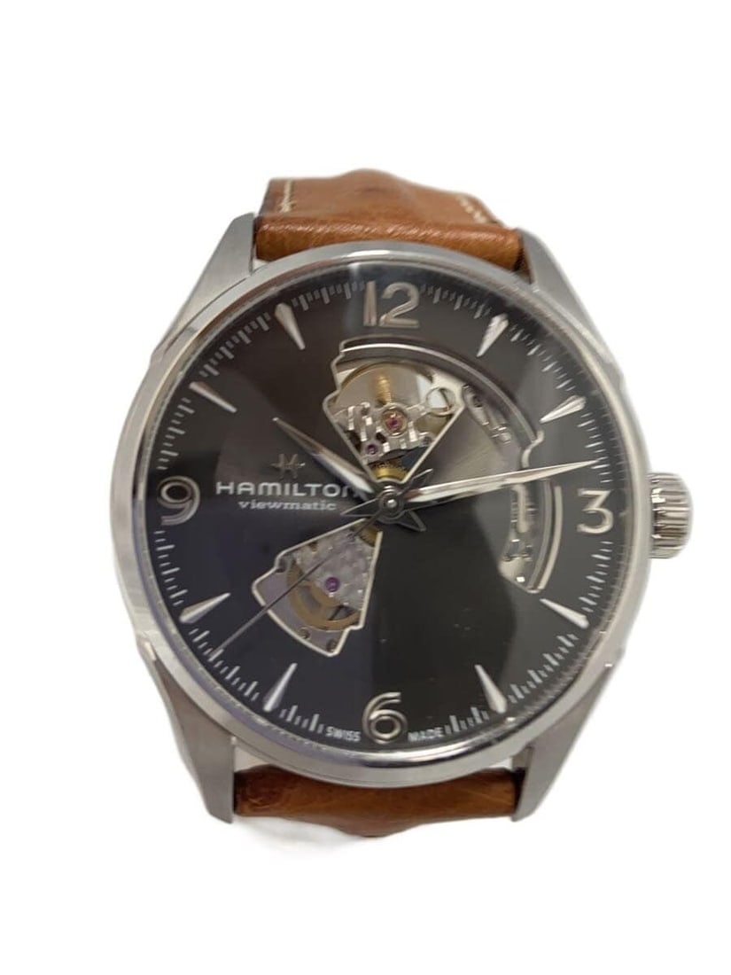 Hamilton Jazzmaster Open Heart Stainless Steel Men's Wristwatch: Hamilton Jazzmaster Open Heart Stainless Steel Men's Wristwatch This is a pre-owned HAMILTON Jazzmaster Open Heart men's wristwatch, crafted in Switzerland. The watch features a stainless steel case a
