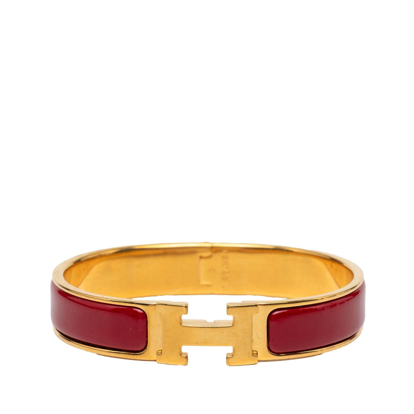 Hermes Clic H PM Narrow Enamel Bracelet Red: Hermes Clic H PM Narrow Enamel Bracelet Red Hermes Narrow Enamel Clic H Bracelet PM in red, featuring a gold plated metal and enamel body with an H toggle clasp closure. It is a costume piece made in 