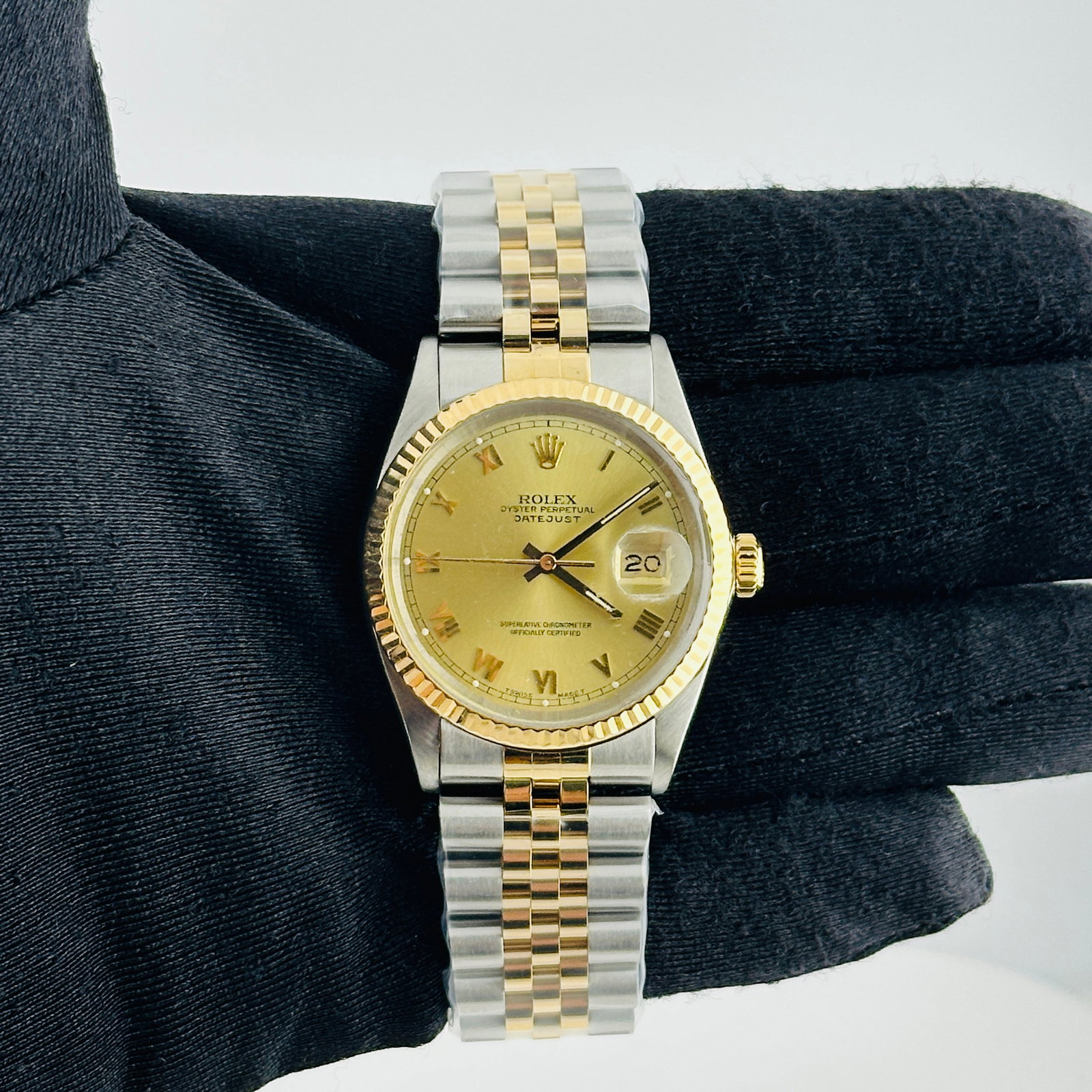 Rolex Datejust 16013 Champagne Roman Dial Aftermarket Jubilee Bracelet: Rolex Datejust 16013 Champagne Roman Dial Aftermarket Jubilee Bracelet This Rolex Datejust features a champagne Roman stick dial, complemented by a fluted bezel and an aftermarket Jubilee bracelet. Th