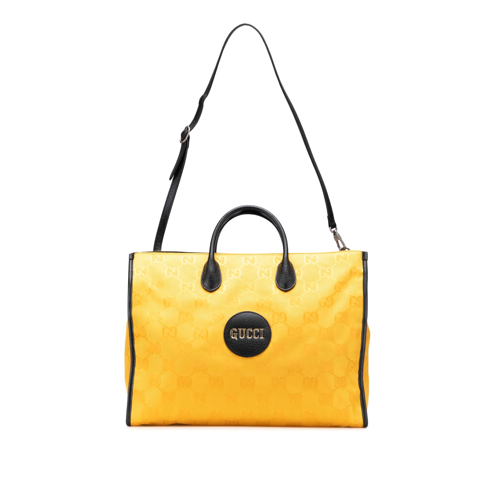 Gucci GG Econyl Off The Grid Yellow Convertible Tote Bag: Gucci GG Econyl Off The Grid Yellow Convertible Tote Bag Introducing the Gucci GG Econyl Off The Grid Convertible Tote, a stylish and sustainable accessory crafted from nylon with luxurious leather tr
