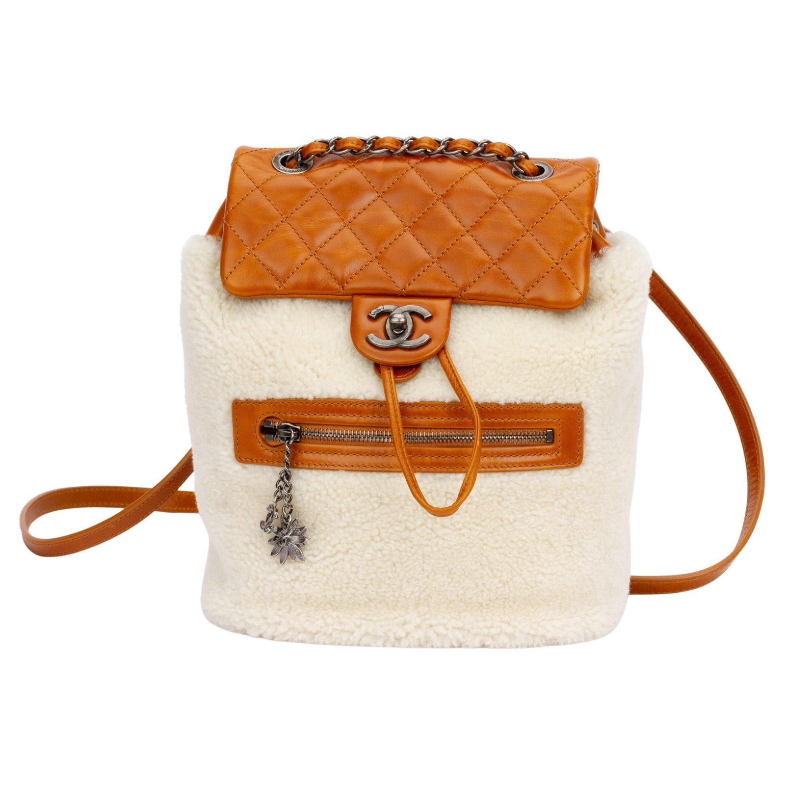 Chanel Brown Shearling Backpack with Cognac Leather and Box: Chanel Brown Shearling Backpack with Cognac Leather and Box Introducing the Chanel New Shearling Brown Backpack, an exquisite designer piece that blends luxury and functionality. This stylish backpack