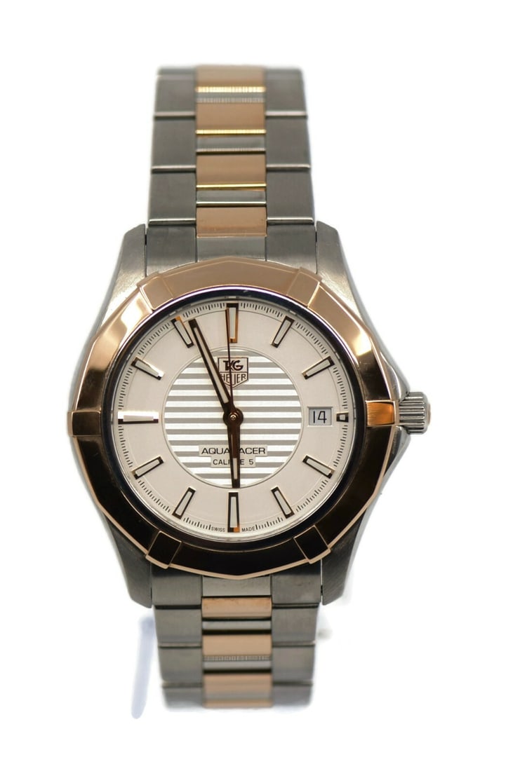 TAG Heuer Aquaracer WAP2150 18K Rose Gold Stainless Steel Wristwatch: TAG Heuer Aquaracer WAP2150 18K Rose Gold Stainless Steel Wristwatch The TAG Heuer Aquaracer WAP2150 is a stunning wristwatch that combines elegance and precision. Crafted from both stainless steel an