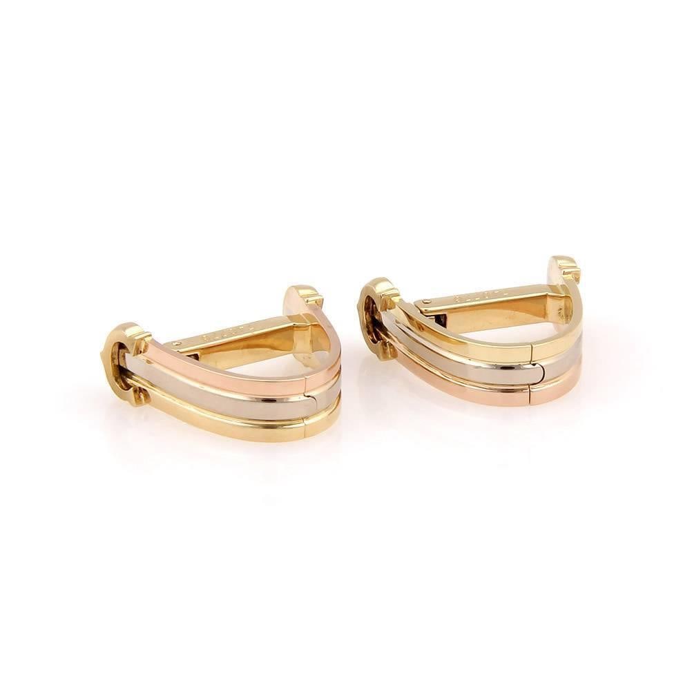 Cartier 18k Tri-Color Gold Oval Cufflinks with Iconic C Signature: Cartier 18k Tri-Color Gold Oval Cufflinks with Iconic C Signature Elevate your accessory collection with these authentic Cartier cufflinks, beautifully crafted from 18k yellow, white, and rose gold. F