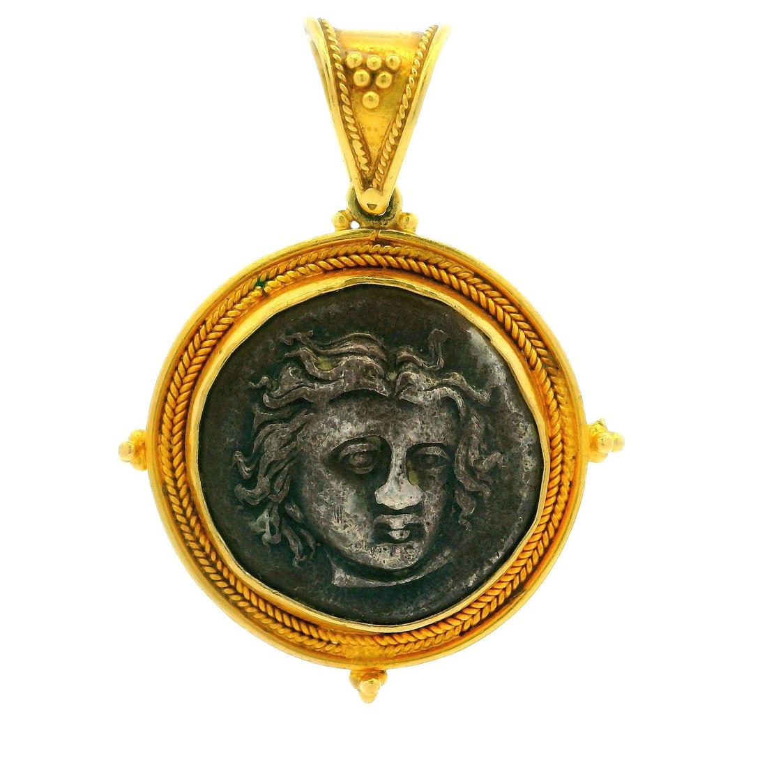 Vintage Silver Ancient Coin Pendant in 22k Yellow Gold Frame: Vintage Silver Ancient Coin Pendant in 22k Yellow Gold Frame This exquisite pendant features a vintage silver ancient coin beautifully framed with a 22k yellow gold wheat and bead design. Crafted with