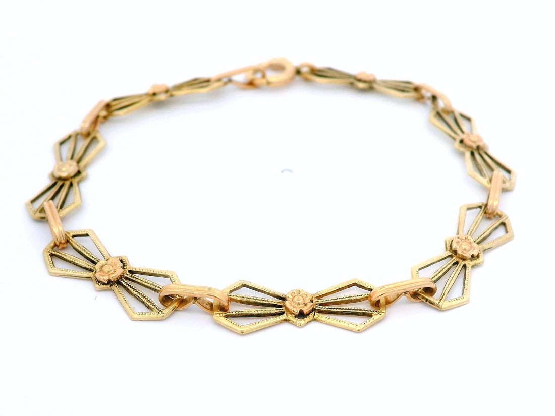 Antique 10k Green Rose Gold Open Work Bracelet by Craft: Antique 10k Green Rose Gold Open Work Bracelet by Craft This exquisite Antique Arts & Crafts bracelet showcases a beautiful combination of 10k green and rose gold in a charming bow geometric open work