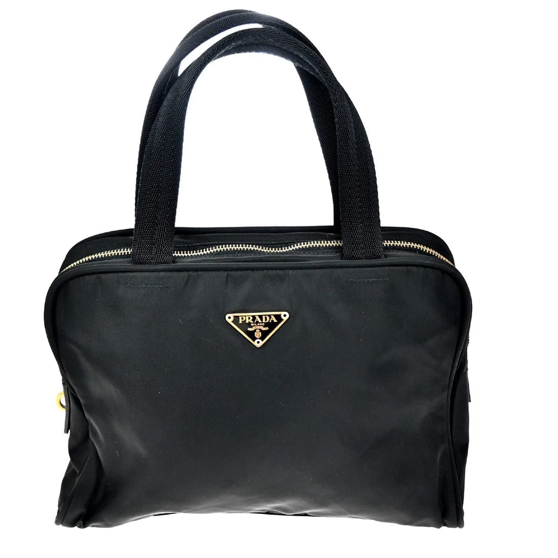 Prada Vintage Black Nylon Handbag Made in Italy: Prada Vintage Black Nylon Handbag Made in Italy This Prada vintage handbag for women features a black nylon exterior with a compact design suitable for everyday use. Crafted in Italy, it shows signs o