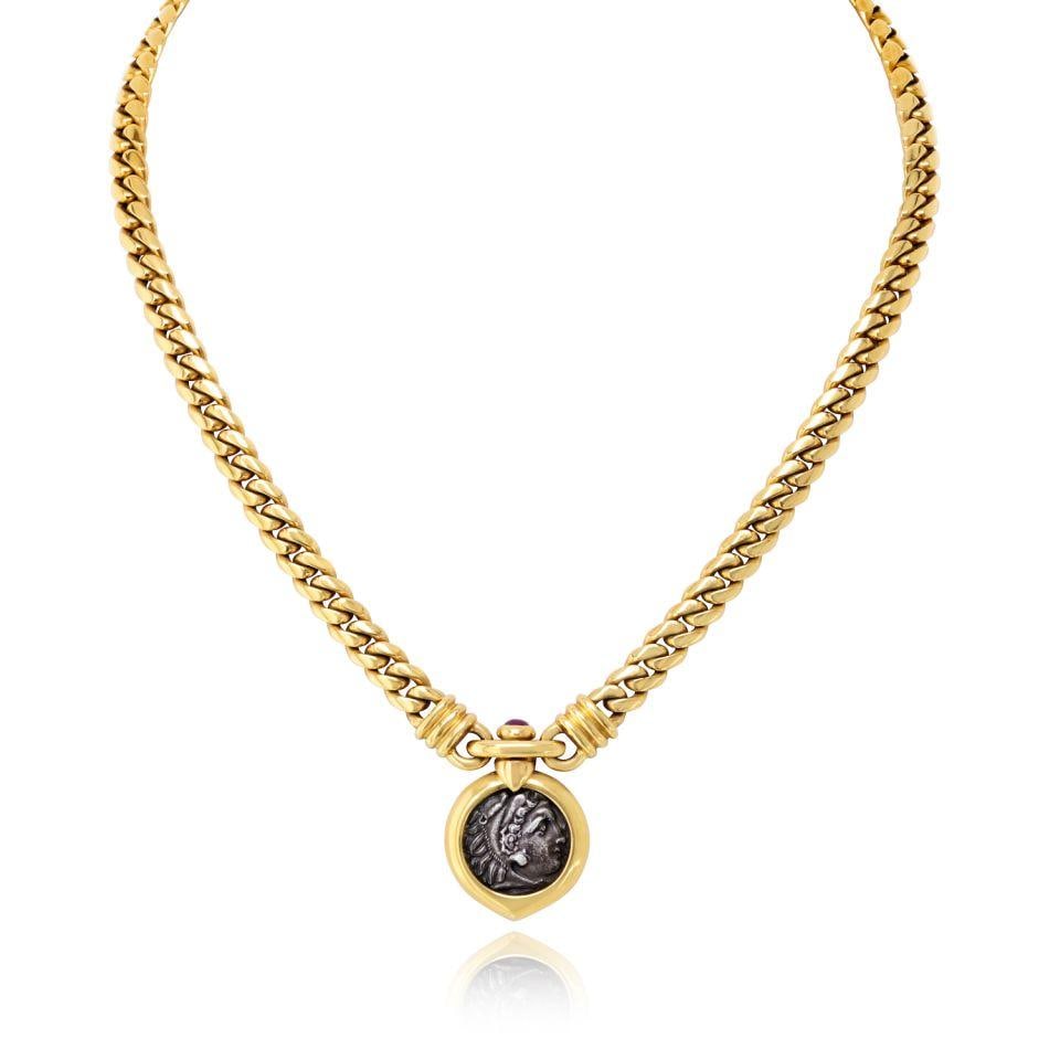 Bvlgari Coin Necklace in 18K Yellow Gold: Bvlgari Coin Necklace in 18K Yellow Gold A pre-owned Bvlgari coin necklace crafted in 18K yellow gold. The piece has a coin style and a total weight of 72.8 grams. Specifications Type: Necklaces Brand