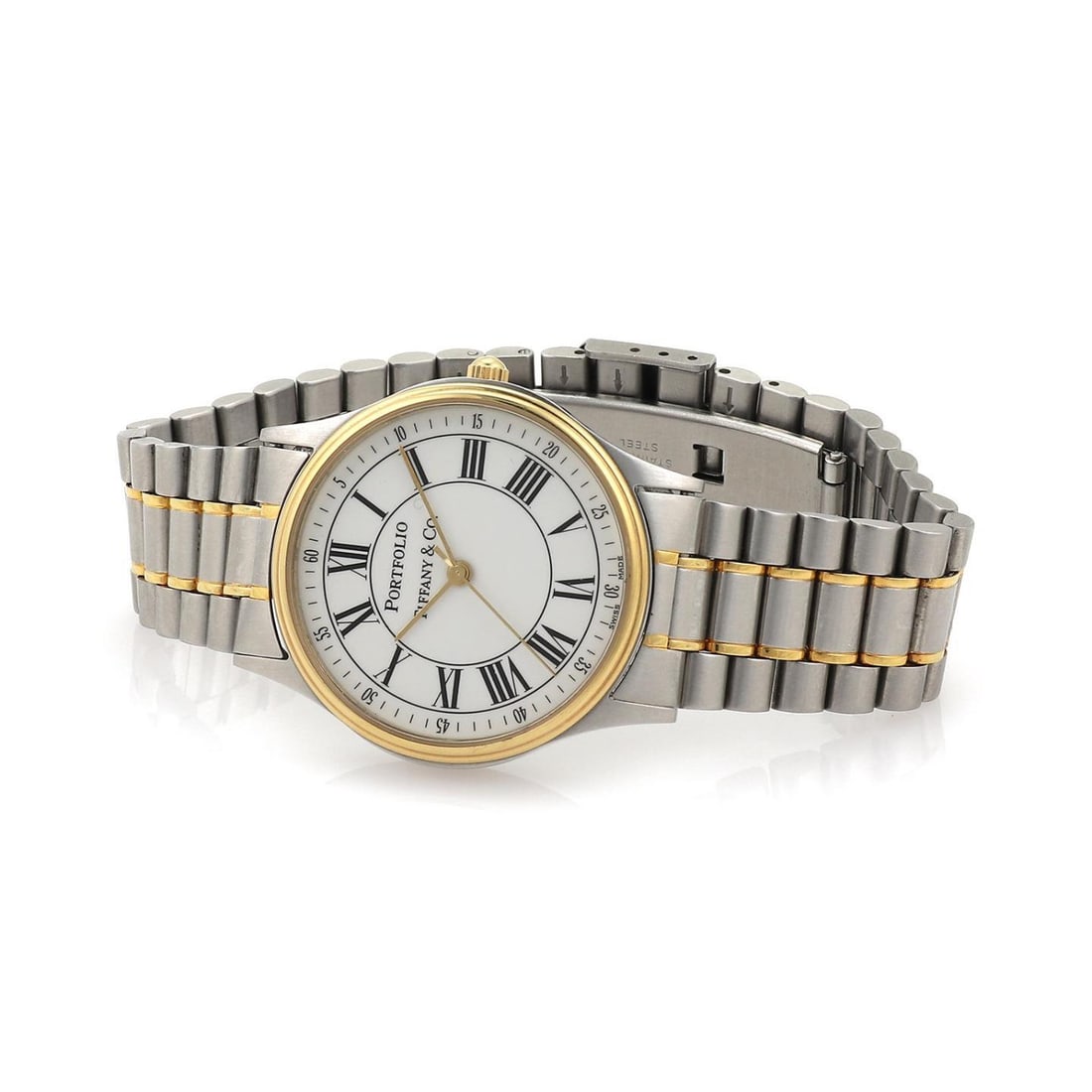 Tiffany & Co. Vintage Stainless Steel Gold Tone Portfolio Watch: Tiffany & Co. Vintage Stainless Steel Gold Tone Portfolio Watch Discover the elegance of the Tiffany & Co. stainless steel and gold tone Portfolio men's wrist watch. This vintage designer timepiece fe