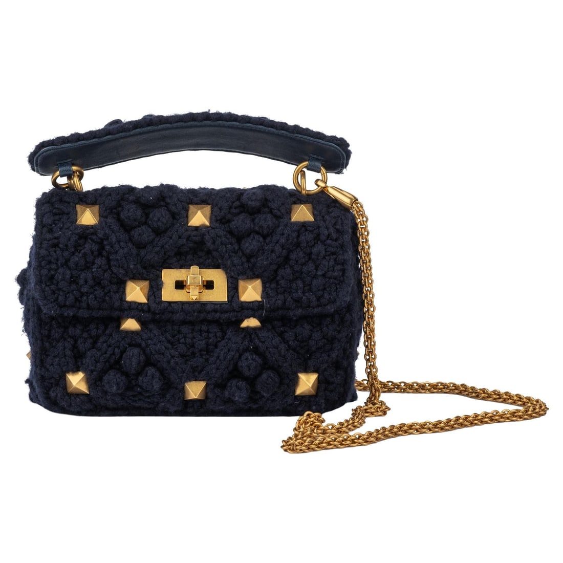 Valentino Roman Stud Navy Cashmere Knitted Bag by Pierpaolo Piccioli: Valentino Roman Stud Navy Cashmere Knitted Bag by Pierpaolo Piccioli Introducing the Valentino Roman Stud Knitted Bag, designed by Pierpaolo Piccioli. This exquisite piece is crafted from luxurious na