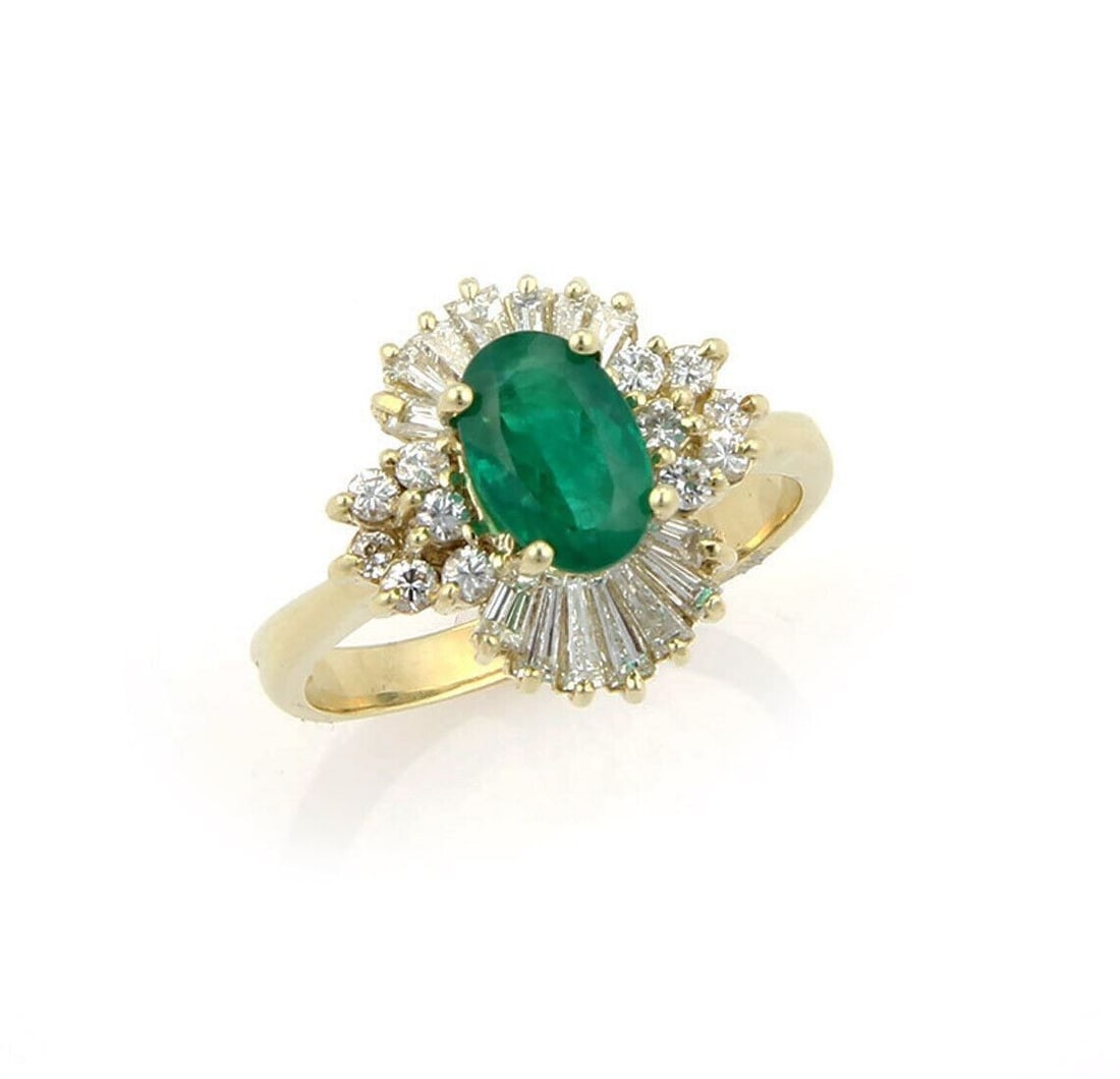 Gemline Emerald Diamond Cocktail Ring in 14k Yellow Gold Size 8.5: Gemline Emerald Diamond Cocktail Ring in 14k Yellow Gold Size 8.5 This Gemline cocktail ring is crafted in 14k yellow gold and features an oval-cut emerald accented by baguette and round-cut diamonds.