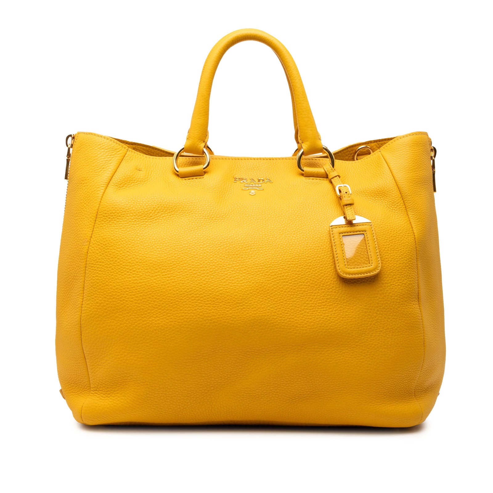 Prada yellow leather convertible tote Vitello Daino side zip: Prada yellow leather convertible tote Vitello Daino side zip This Prada Vitello Daino Side Zip Convertible Tote is crafted from yellow leather and features rolled leather handles, exterior side zipper