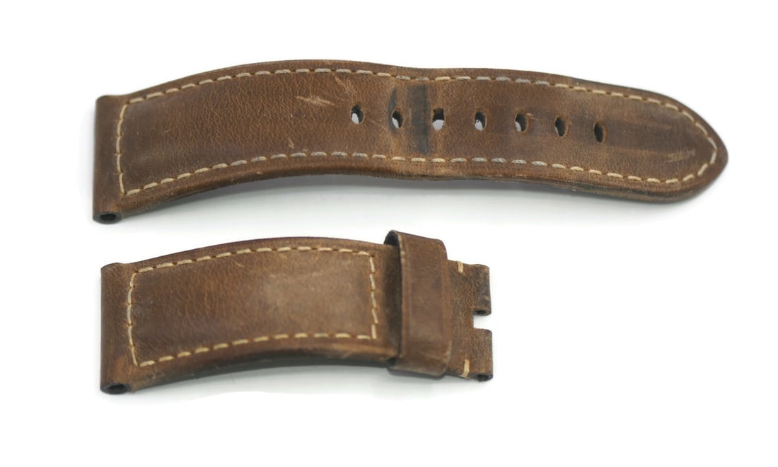 Authentic Panerai Brown Leather Wristwatch Strap 24mm: Authentic Panerai Brown Leather Wristwatch Strap 24mm Elevate your timepiece with this Panerai Brown Leather Strap. Crafted from high-quality leather, this wristwatch band features a stylish brown col