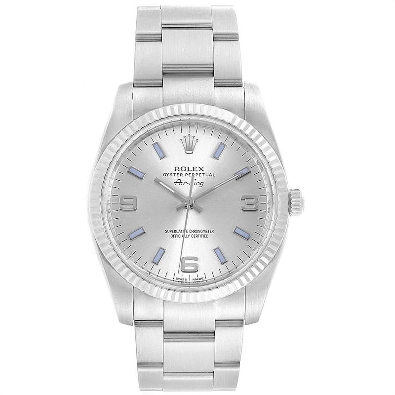 Rolex 114234 Air-King watch with silver dial Oyster bracelet: Rolex 114234 Air-King watch with silver dial Oyster bracelet Rolex Air-King wristwatch with a silver dial featuring 3, 6, and 9 numerals with blue markers, set on an Oyster bracelet. The watch is iden