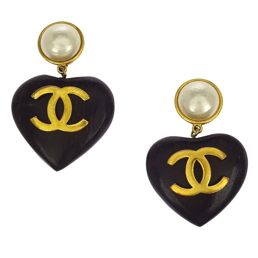 CHANEL Clip On Dangle Earrings Gold Plated Pearl Black Heart: CHANEL Clip On Dangle Earrings Gold Plated Pearl Black Heart Clip-on dangle earrings by Chanel featuring artificial pearls and a black heart design. Crafted in gold-plated metal with wood and artifici
