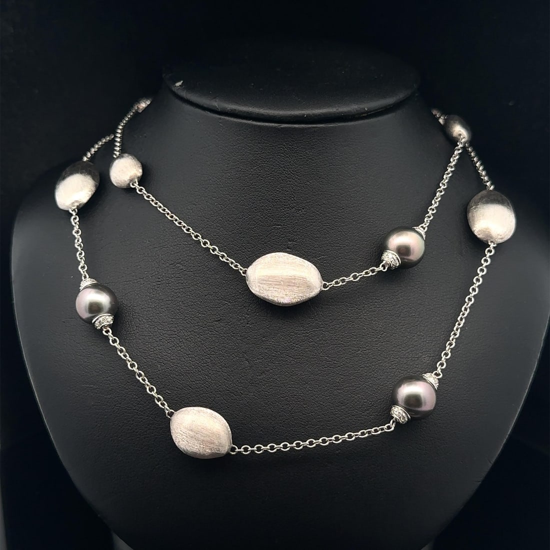 Marco Bicego 18k White Gold Necklace with Tahitian Pearls and Diamonds 30 Inch: Marco Bicego 18k White Gold Necklace with Tahitian Pearls and Diamonds 30 Inch This elegant necklace by Marco Bicego features a 30-inch cable link chain crafted from solid 18k white gold. The design a
