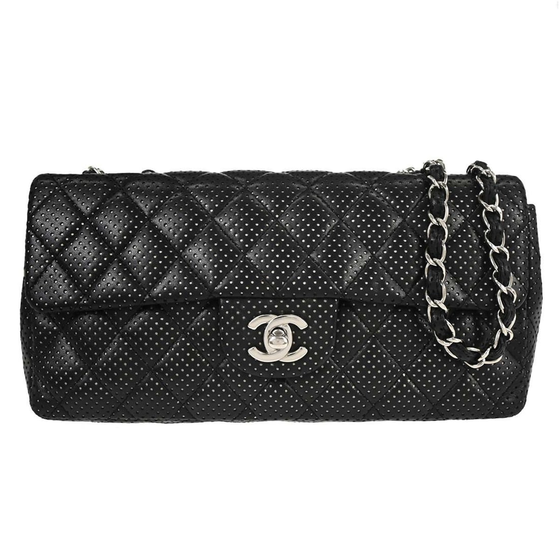 CHANEL East West Shoulder Bag Black Perforated Lambskin Turnlock: CHANEL East West Shoulder Bag Black Perforated Lambskin Turnlock Chanel East West shoulder bag in black perforated lambskin with a flap turnlock closure, chain strap, and three inner pockets. Made in 