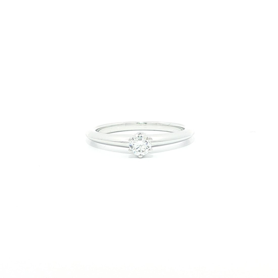 Platinum Engagement Ring With 0.20ct Diamond And Original Box By Tiffany & Co.: Platinum Engagement Ring With 0.20ct Diamond And Original Box By Tiffany & Co. This Tiffany & Co. engagement ring features a 0.20 carat round brilliant cut natural diamond set in solid platinum. The d