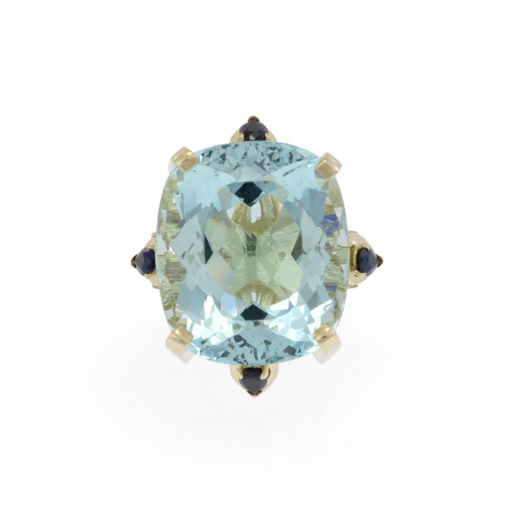 Elegant 14k Yellow Gold Aquamarine & Sapphire Cocktail Ring: Elegant 14k Yellow Gold Aquamarine & Sapphire Cocktail Ring This exquisite cocktail ring showcases a large oval aquamarine gemstone, measuring 22mm long x 20mm wide, beautifully mounted on a high pron