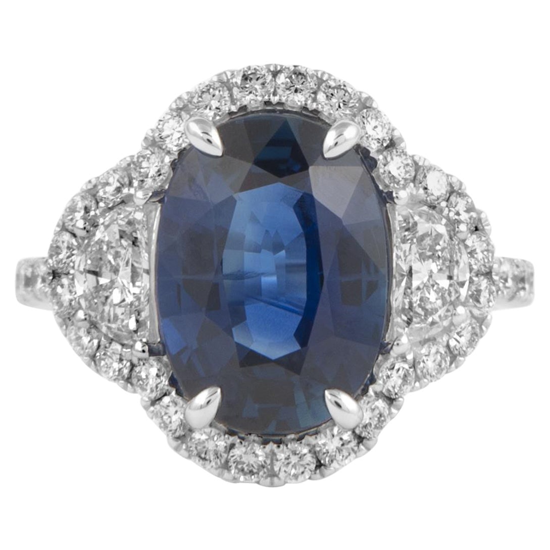 4.46ct Oval Sapphire Diamond 3-Stone Ring 18k White Gold: 4.46ct Oval Sapphire Diamond 3-Stone Ring 18k White Gold This exquisite 4.46 carat oval sapphire and diamond three-stone ring is crafted in 18k white gold, showcasing a stunning navy blue sapphire at 