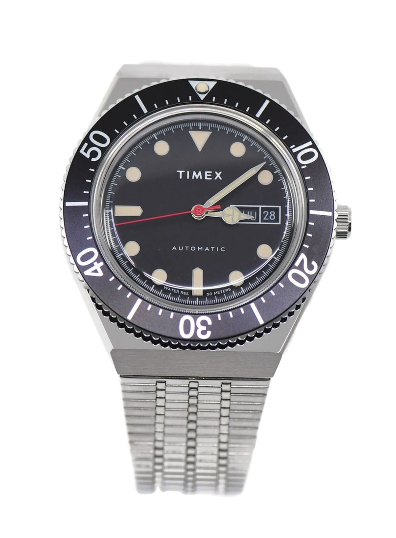 Timex M79 Automatic Stainless Steel Watch TW2U78300ZV with Box: Timex M79 Automatic Stainless Steel Watch TW2U78300ZV with Box Discover the Timex M79 Stainless Steel Watch, a striking timepiece that combines classic design with modern functionality. This wristwatc