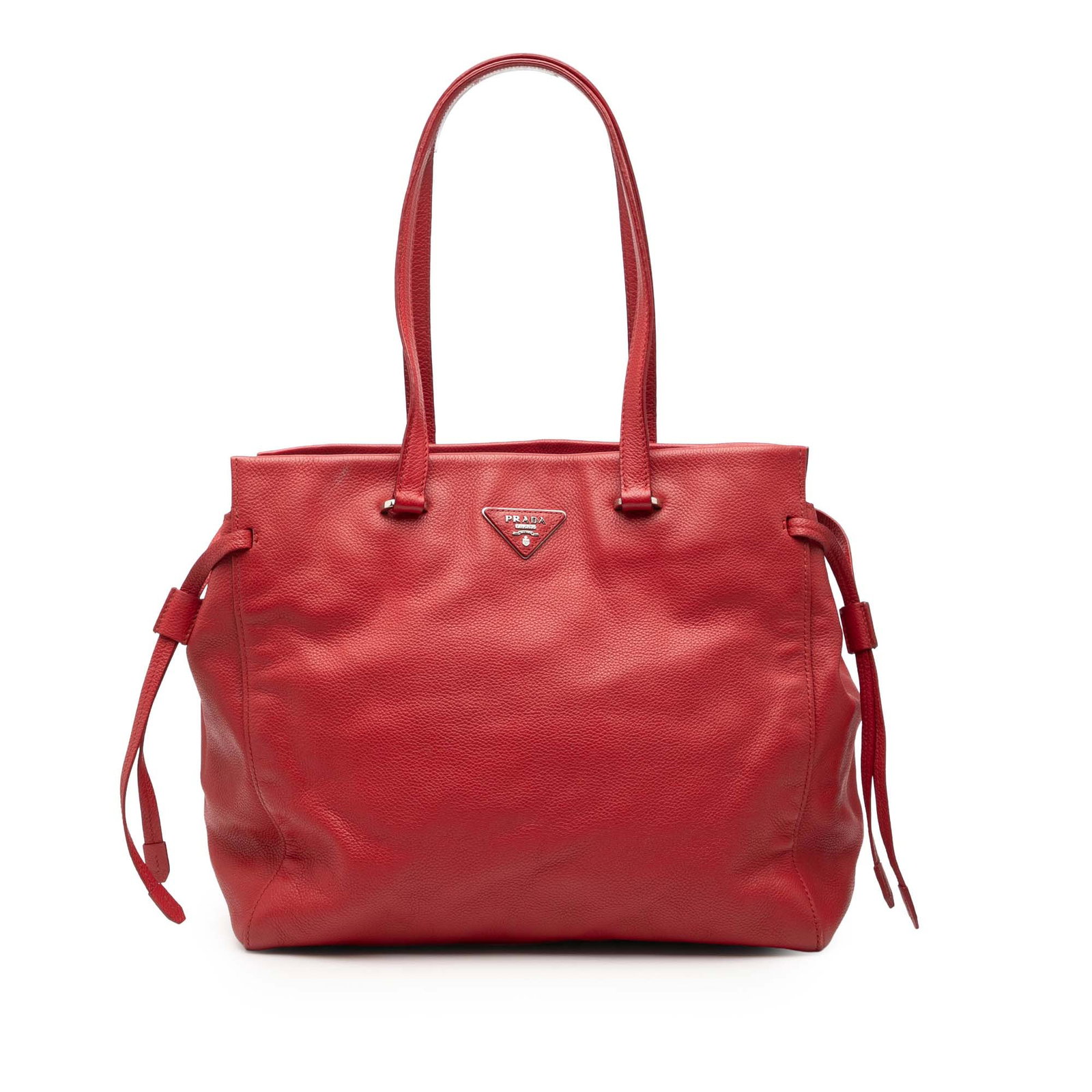 Prada Red Leather Vitello Daino Tote with Button Closure: Prada Red Leather Vitello Daino Tote with Button Closure This Prada Vitello Daino Tote features a red leather body with flat leather straps, an open top secured by a button closure, and interior zip a
