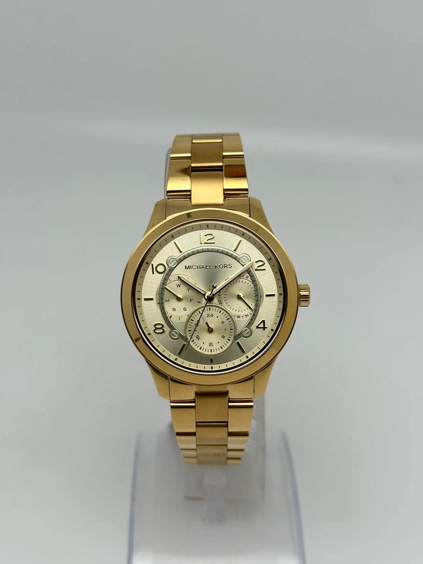 Michael Kors Runway MK6588 38mm Gold Tone Quartz Ladies Watch: Michael Kors Runway MK6588 38mm Gold Tone Quartz Ladies Watch The Michael Kors Runway 38mm Yellow PVD Steel Champagne Quartz Ladies Watch (Model MK6588) is a stylish and elegant timepiece designed for