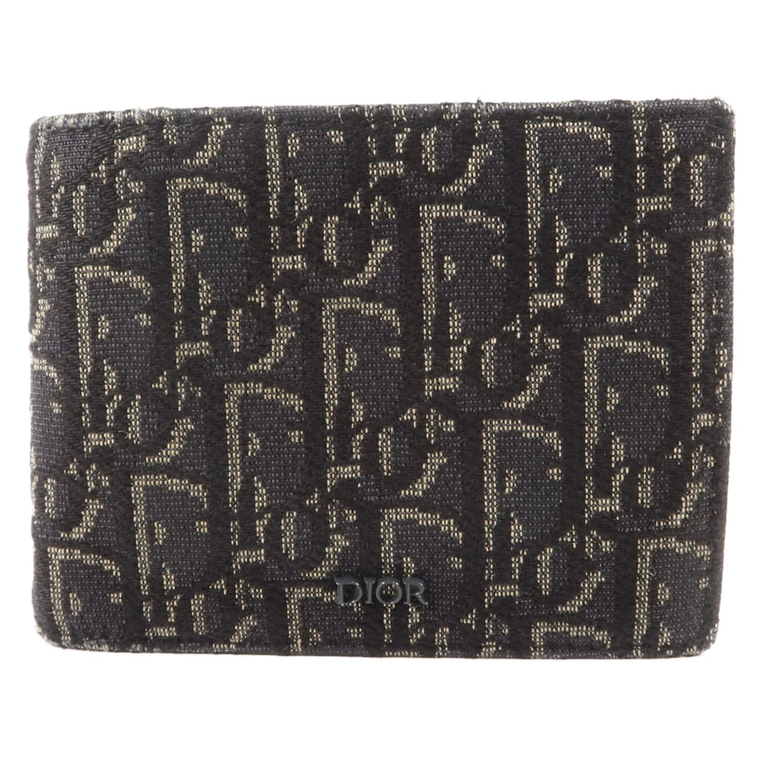 Dior CD canvas bi fold wallet in black and navy: Dior CD canvas bi fold wallet in black and navy A men's Christian Dior bi-fold wallet made from canvas in black and navy. It features two wallet compartments, eight card slots, and two open pockets. M