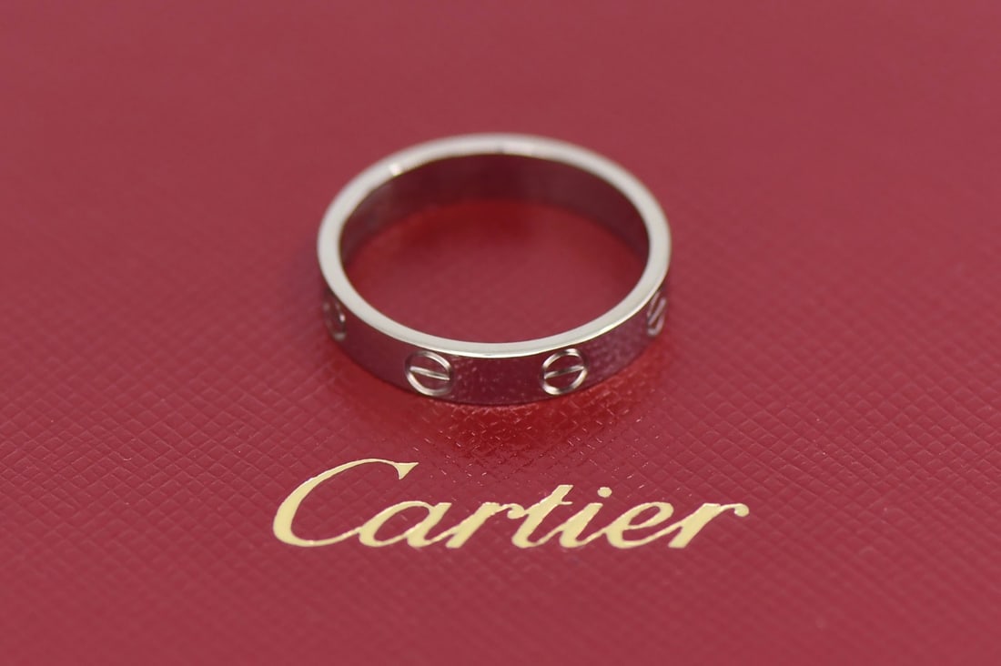 Cartier Love 18K White Gold Ring Size 58: Cartier Love 18K White Gold Ring Size 58 This Cartier Love ring is crafted in 18K white gold and features the iconic Love design. The ring is a small model, size 58 (equivalent to US size 6.5), with a