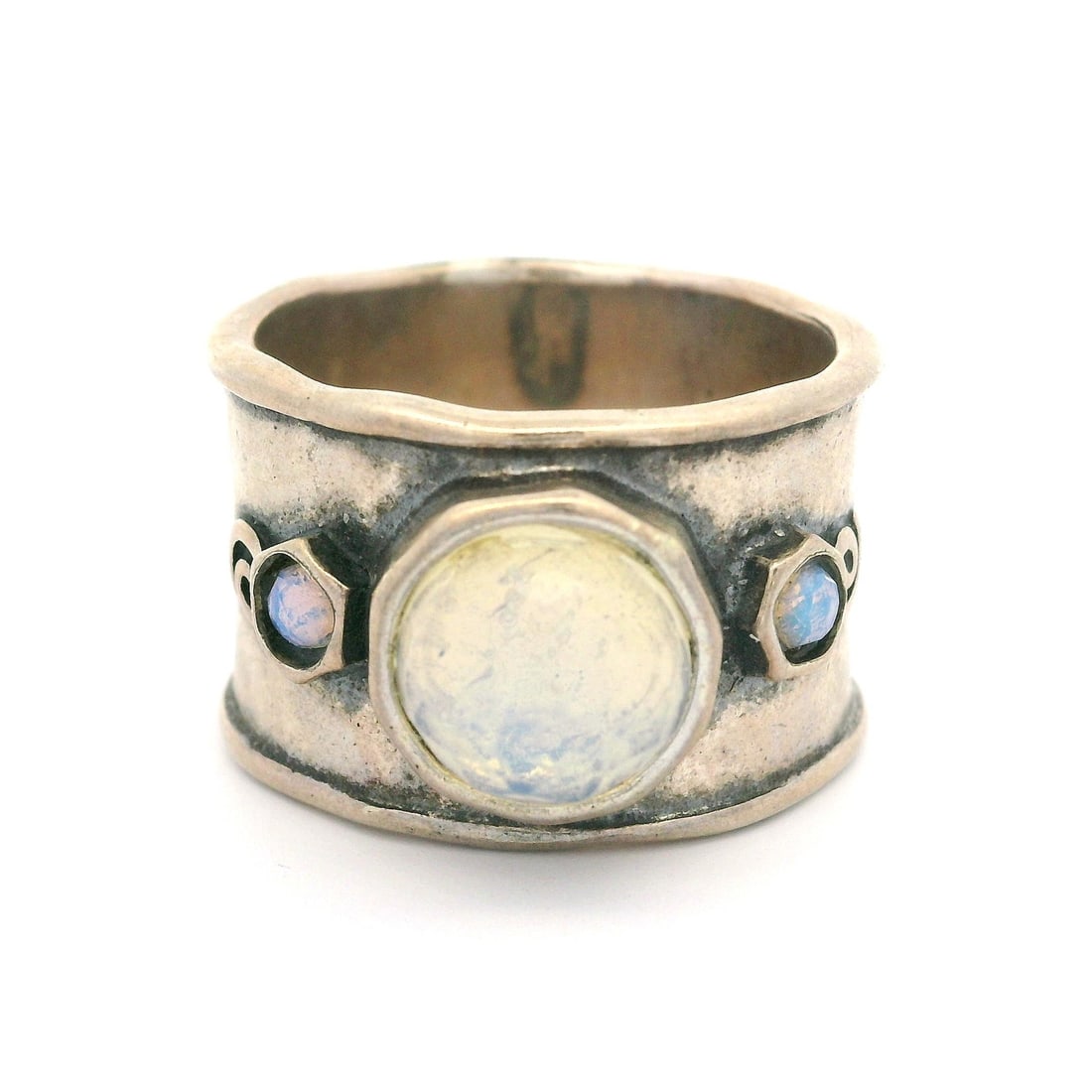 Vintage Sterling Silver Cigar Band Ring with Synthetic Opals: Vintage Sterling Silver Cigar Band Ring with Synthetic Opals This vintage cigar band ring is crafted from high-quality sterling silver and features a unique hammered finish. It showcases two synthetic