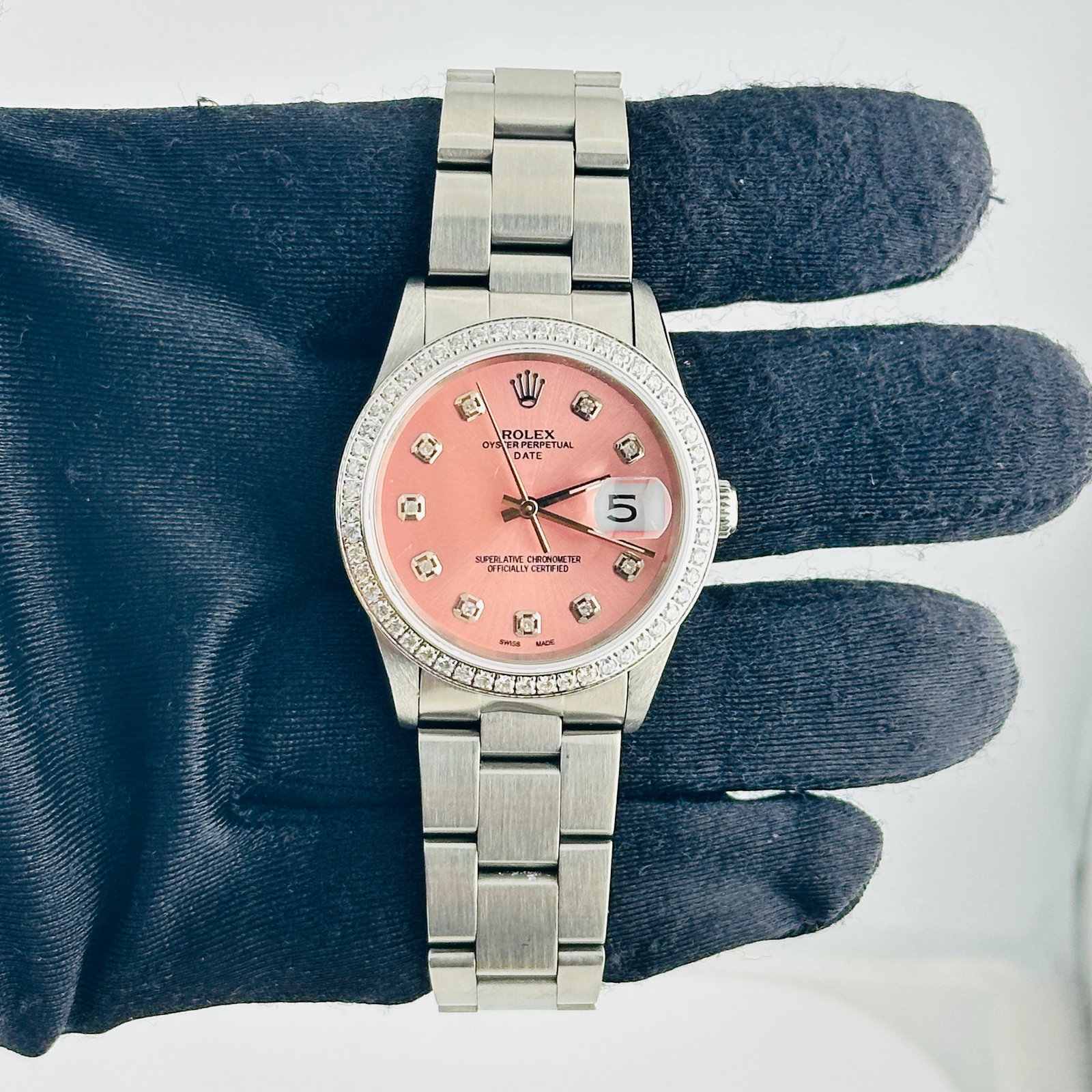 Rolex Date 15200 Oyster Bracelet with Aftermarket Pink Diamond Dial: Rolex Date 15200 Oyster Bracelet with Aftermarket Pink Diamond Dial Rolex Date Ref. 15200 unisex watch with an Aftermarket pink diamond dial, Aftermarket pave diamond bezel, and Oyster bracelet. The l