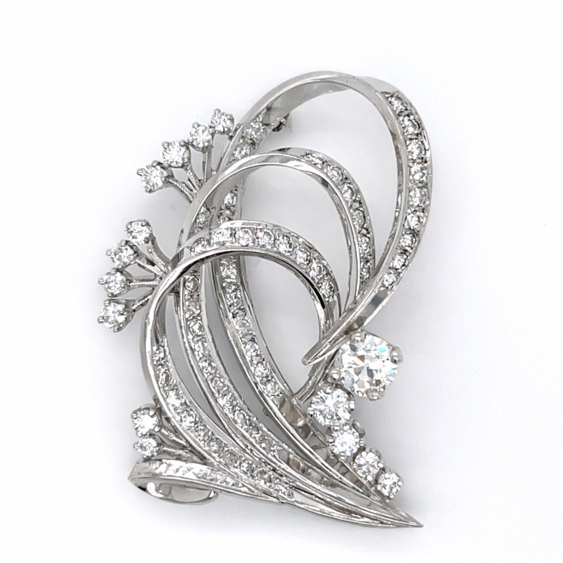 Platinum Art Deco Brooch with 3.40 Carat Diamonds 2 Inch Length: Platinum Art Deco Brooch with 3.40 Carat Diamonds 2 Inch Length This Art Deco brooch is crafted in platinum and set with a total of approximately 3.40 carats of diamonds. The centerpiece features a 0.