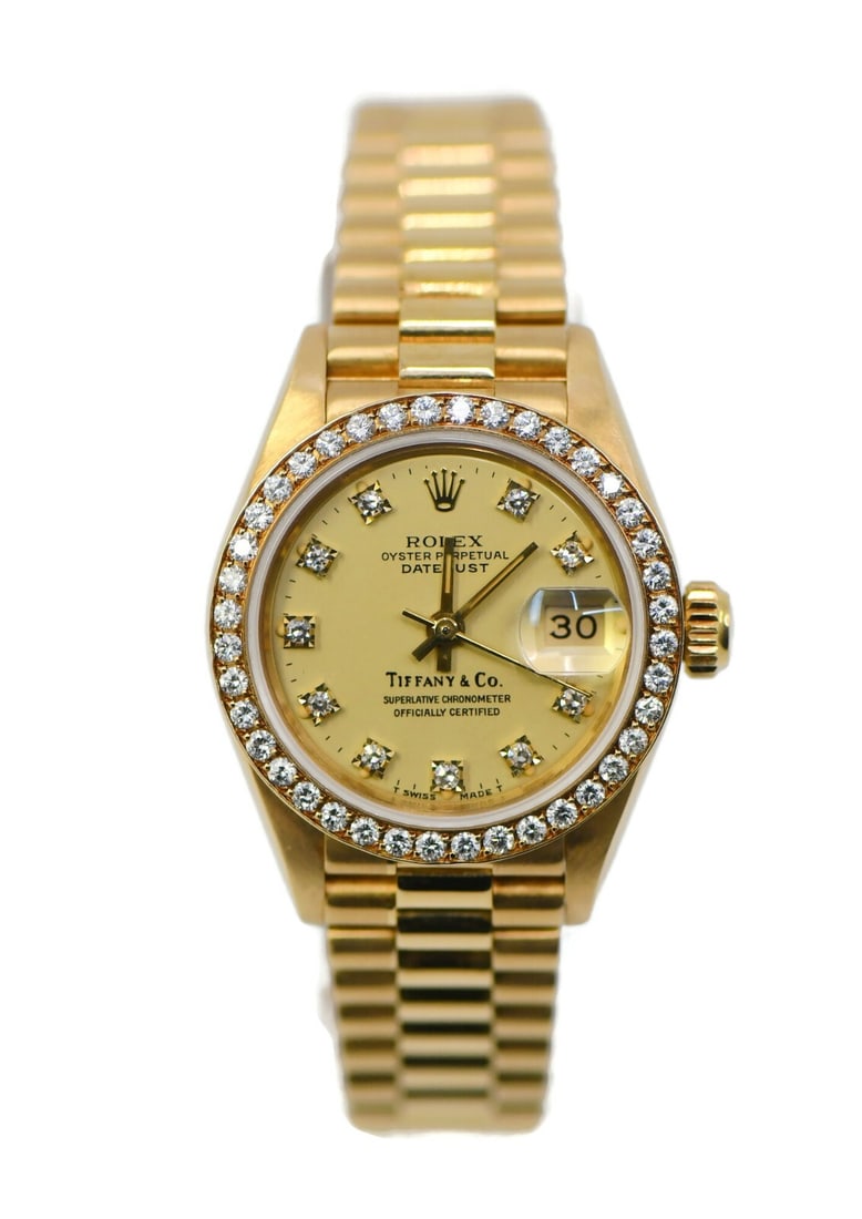 Rolex Datejust President 18K Yellow Gold Tiffany Dial Watch Ref 69138: Rolex Datejust President 18K Yellow Gold Tiffany Dial Watch Ref 69138 This exquisite Rolex Datejust President watch features a stunning Tiffany & Co. dial adorned with factory diamonds. Crafted from 1