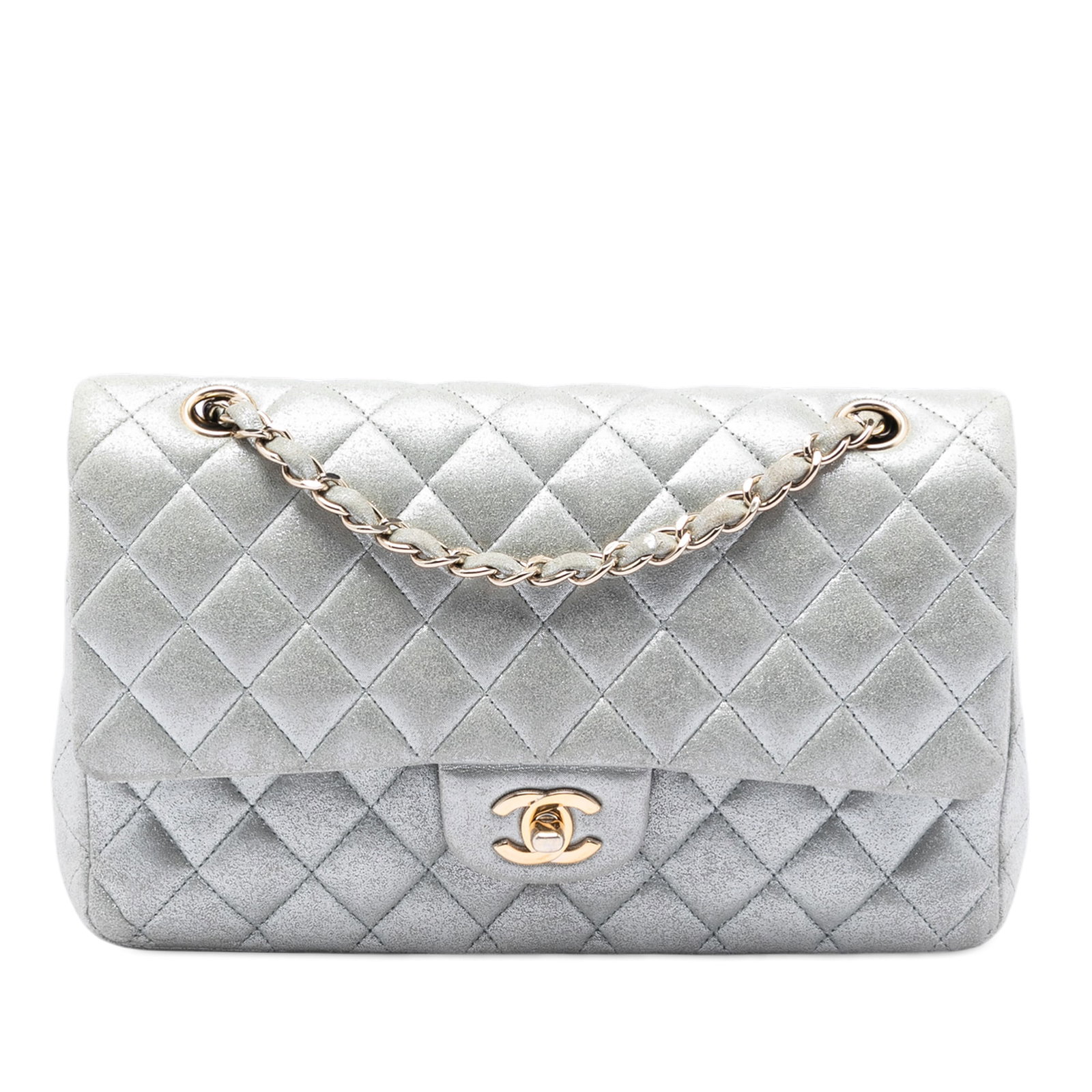 Chanel Silver Quilted Leather Medium Classic Double Flap Shoulder Bag: Chanel Silver Quilted Leather Medium Classic Double Flap Shoulder Bag This Chanel Medium Classic Metallic Lambskin Double Flap shoulder bag features a quilted calf leather body with a metallic finish,