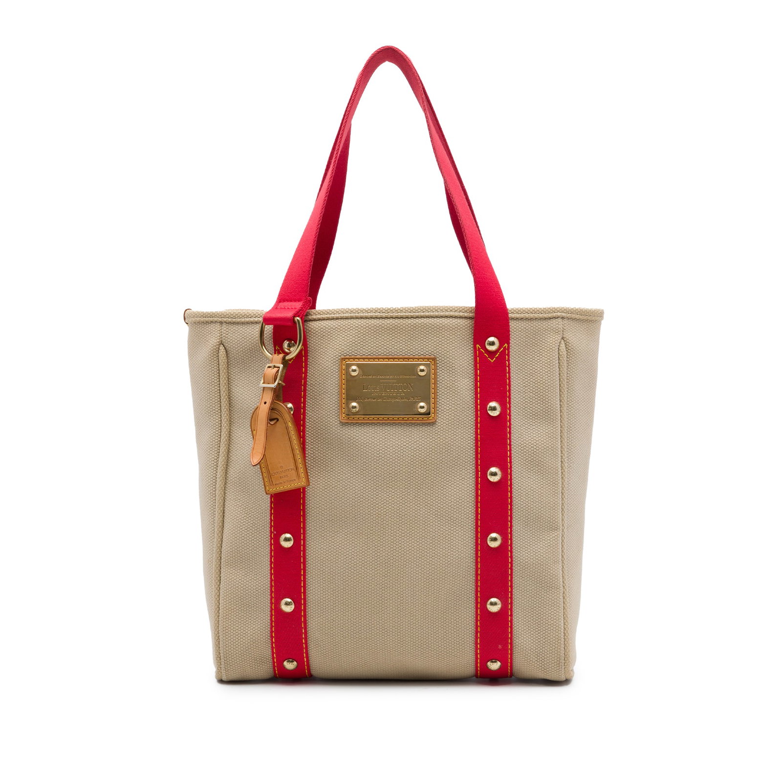 Louis Vuitton Antigua Cabas MM canvas shoulder bag beige: Louis Vuitton Antigua Cabas MM canvas shoulder bag beige Louis Vuitton Antigua Cabas MM bag in beige fabric with a canvas body. It features flat shoulder straps, a top zip closure, and an interior sli