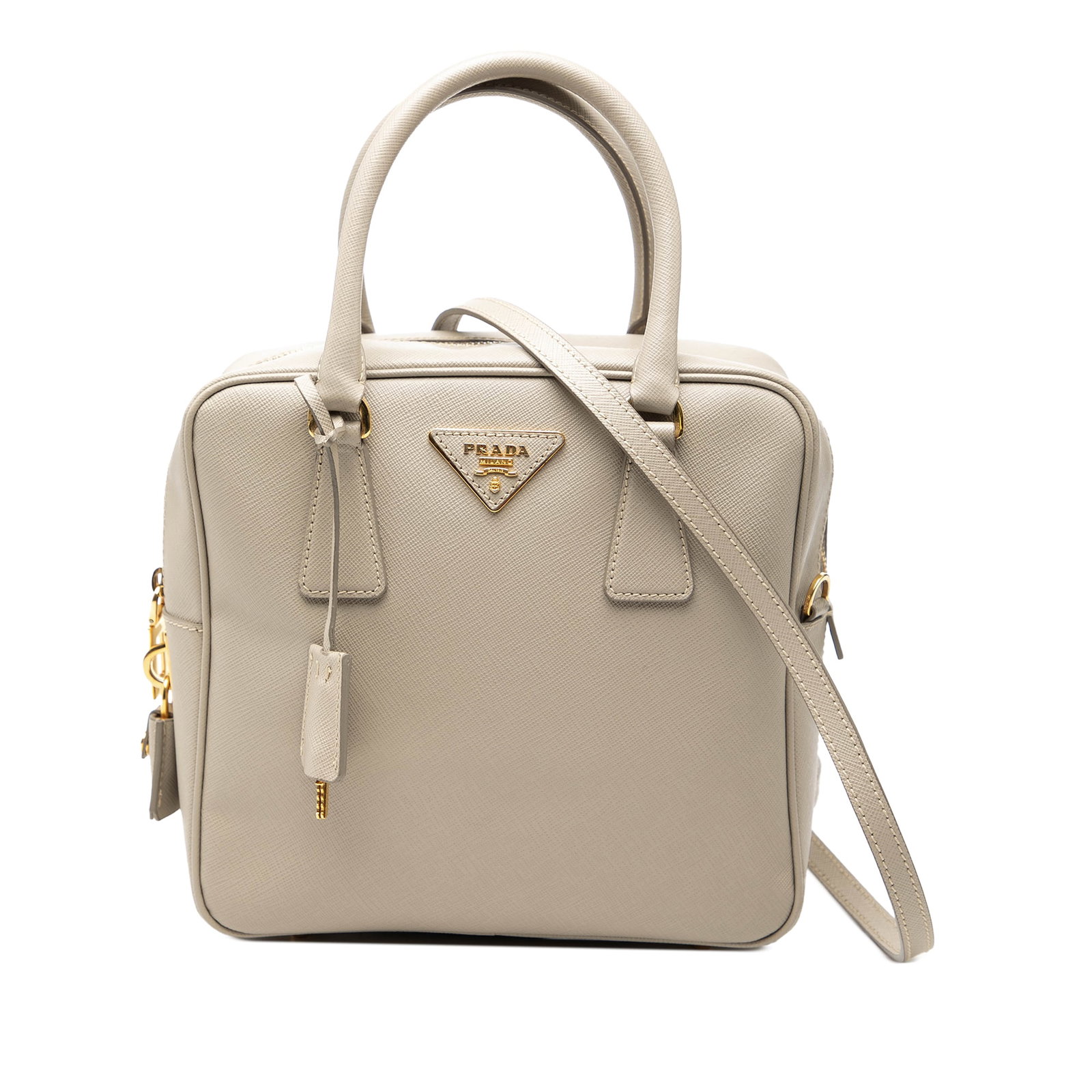 Prada Saffiano Lux Beige Leather Satchel with Detachable Strap: Prada Saffiano Lux Beige Leather Satchel with Detachable Strap This Prada Saffiano Lux Satchel showcases a beige saffiano leather body with rolled leather handles and a detachable flat leather strap. 