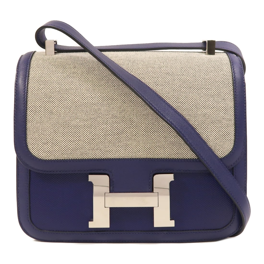 Hermes Constance 24 Shoulder Bag Toile Swift Leather Bleu Encre PHW: Hermes Constance 24 Shoulder Bag Toile Swift Leather Bleu Encre PHW Hermes Constance 24 shoulder bag in Toile/Swift leather, presented in Bleu Encre. It features a flap closure, one open interior pock