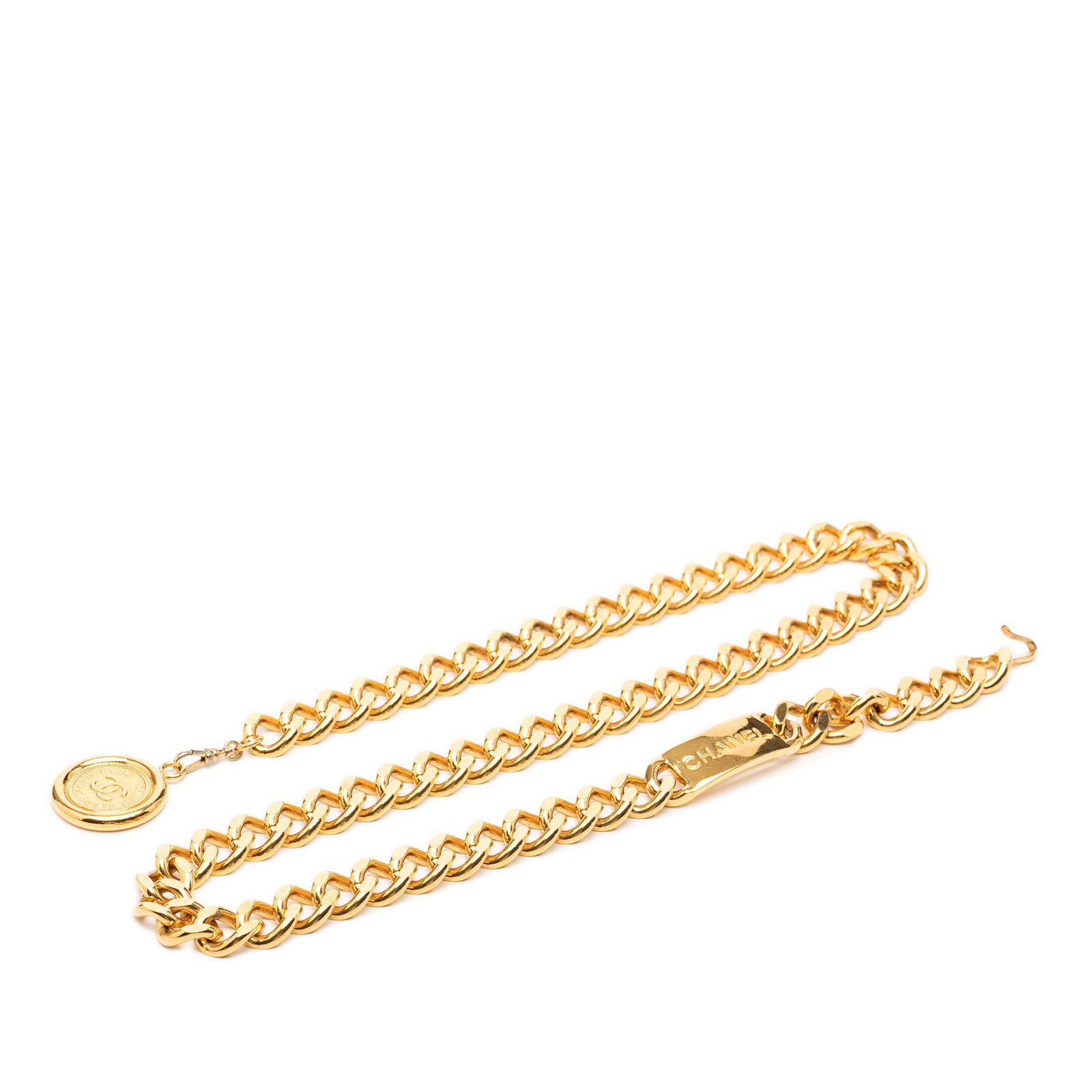 Chanel CC Medallion Gold Plated Chain Belt: Chanel CC Medallion Gold Plated Chain Belt Gold-plated Chanel chain link belt featuring a CC medallion charm and hook closure. Made in France, this accessory has visible wear including rusty or tarnis