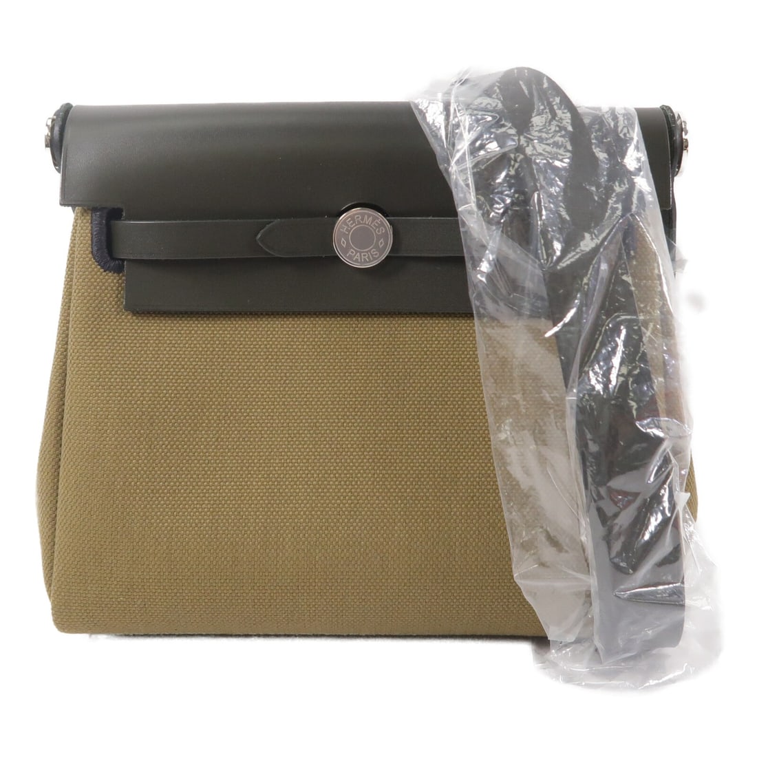 HERMES Mini Herbag Shoulder Bag Toile Militaire Khaki Vert Olive PHW: HERMES Mini Herbag Shoulder Bag Toile Militaire Khaki Vert Olive PHW Hermes PHW Mini Herbag Shoulder Bag in Toile Militaire Vert Olive/Kaki. This women's shoulder bag is made from canvas and features 