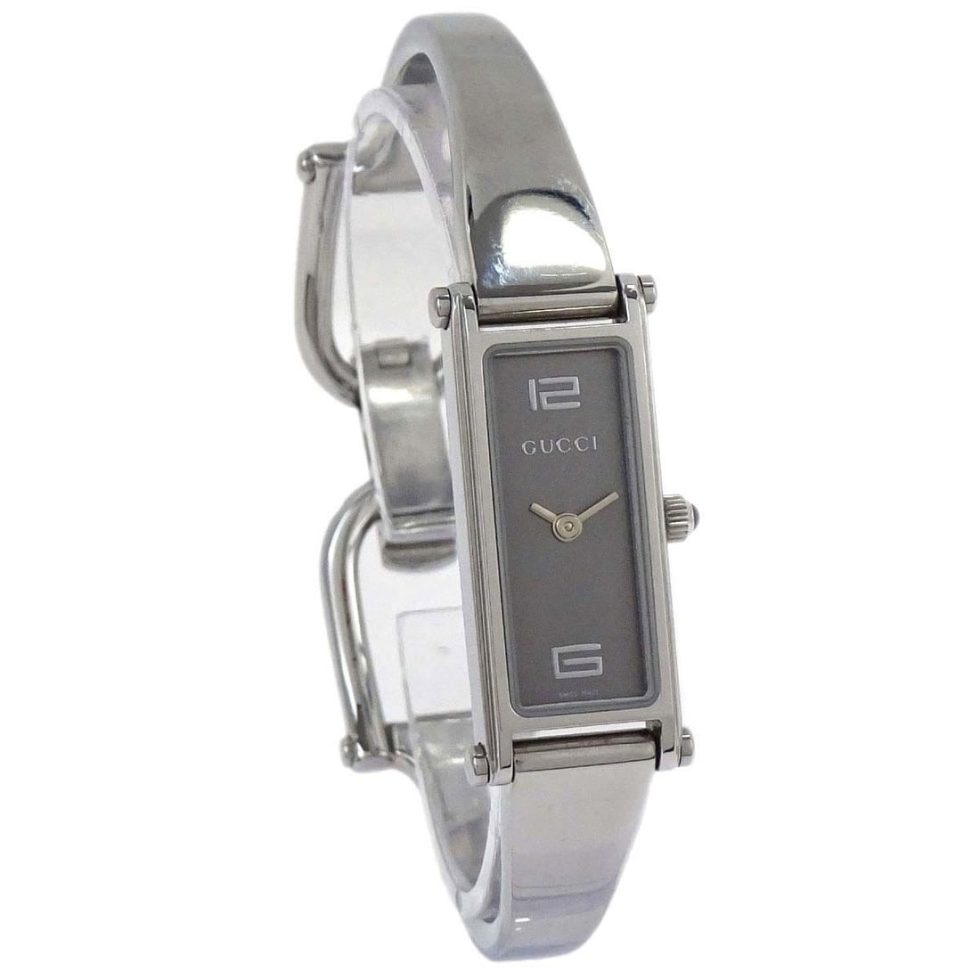 Gucci 1500L Women's Stainless Steel Swiss Made Quartz Wristwatch: Gucci 1500L Women's Stainless Steel Swiss Made Quartz Wristwatch Gucci 1500L women's wristwatch with a silver stainless steel case and band, white dial, and rectangle watch shape. It features a quartz