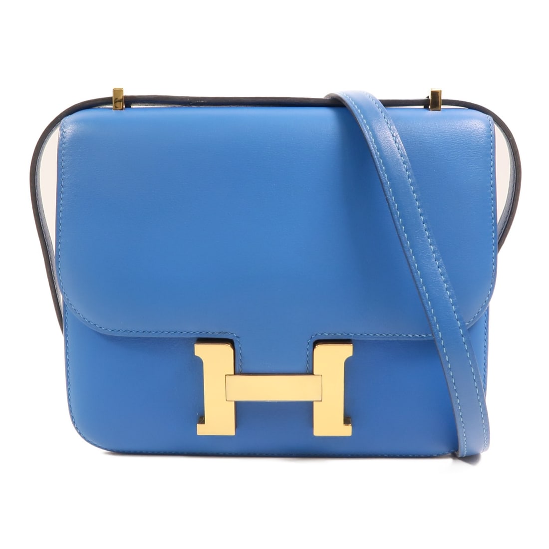 Hermes Constance Mini Veau Swift Calfskin Shoulder Bag Bleu Izmir GHW: Hermes Constance Mini Veau Swift Calfskin Shoulder Bag Bleu Izmir GHW A Hermes Constance Mini shoulder bag in Bleu Izmir blue, crafted from Veau Swift leather and calfskin (cowhide). This bag features