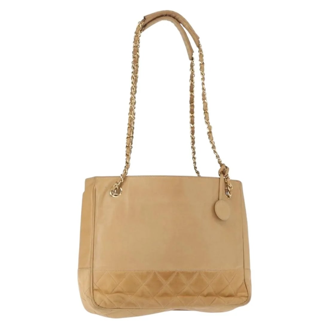 Chanel Beige Lambskin Vintage Shopping Tote Bag 27cm by 22cm by 5cm: Chanel Beige Lambskin Vintage Shopping Tote Bag 27cm by 22cm by 5cm This vintage Chanel shopping tote is crafted from beige lambskin leather, designed for women. The tote features signs of wear includ