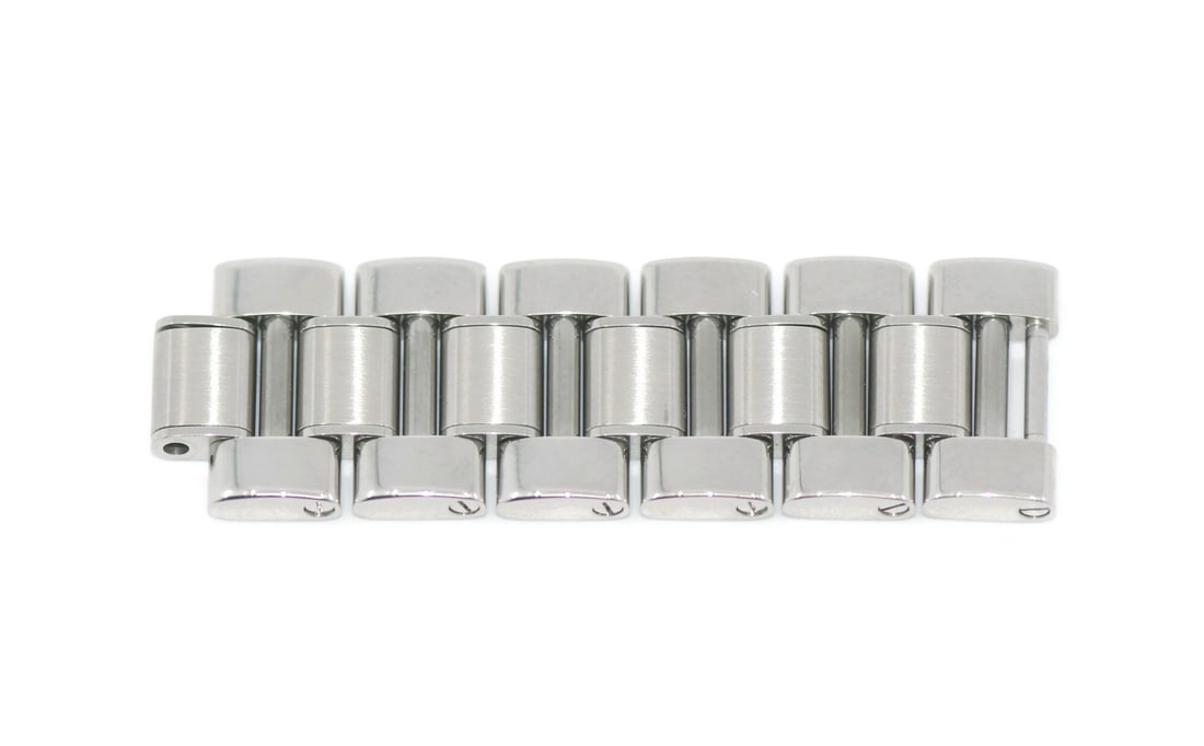 Cartier Must 21 16mm Stainless Steel Band Link: Cartier Must 21 16mm Stainless Steel Band Link A Cartier Must 21 stainless steel band link with a 16 mm width. This pre-owned link is compatible with the Cartier Must model and was made in Switzerland