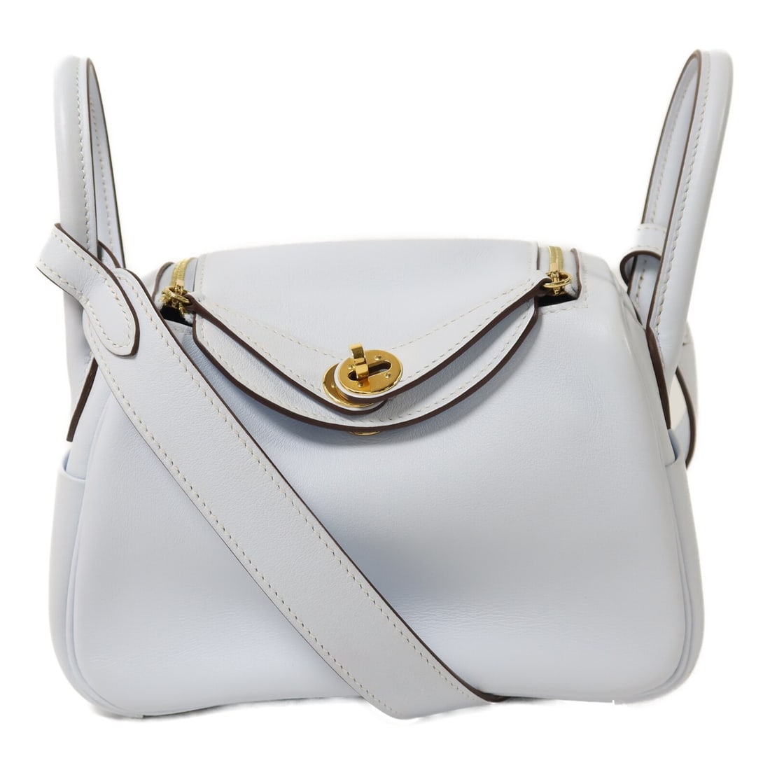 Hermes Mini Lindy 2 Way Shoulder Bag Veau Swift Bleu Brume GHW: Hermes Mini Lindy 2 Way Shoulder Bag Veau Swift Bleu Brume GHW A Mini Lindy 2 Way Shoulder Bag in Bleu Brume, made from Veau Swift leather with calfskin trim. It features a Z stamp indicating manufact