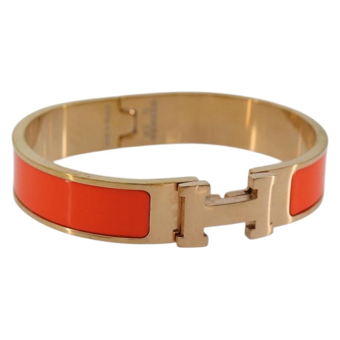 Hermes Click H Orange Metal Bracelet Auth France: Hermes Click H Orange Metal Bracelet Auth France Orange metal Click H bracelet made in France. The item measures approximately 16 cm in total length (6.3 inches). Condition is ranked B, with slight ru